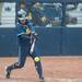Michigan senior Ashley Lane hits the ball during the forth  inning for their game against Iowa at Alumni field Saturday, April 20.
Courtney Sacco I AnnArbor.com